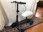 Kneerover Steerable Scooter, Black, Plush Pad. Fixed Price $64.99.