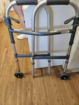 Invacare Folding Adult Walker With Wheels. Fixed Price $24.00.