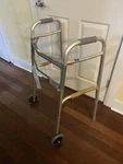 Medline Lightweight Two Button Folding Walker With 5" Wheels, Aluminum Frame. Fixed Price $30.00.