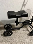 Open Box Steerable Knee Walker Deluxe Medical Scooter - Black With Cushion. Fixed Price $63.99.