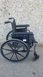 Black Invacare Tracer SX5 Wheelchair Featuring Sturdy Arm Rests. Fixed Price $101.00.