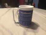 Handsteady Non-spill Cup Mug, Rotatable Handle + Lid 250ML Mobility Support New. Fixed Price $40.00.