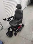 Merits Power Wheelchair Joystick Flip Up Armrests Black Seat Red Fenders. Fixed Price $200.00.