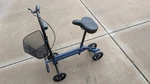 Kneerover Steerable Seated Scooter Mobility Walker - Sitting. Fixed Price $150.00.