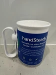 Handsteady Non-spill Cup Mug, Rotatable Handle + Lid 250ML Mobility Support New. Fixed Price $35.00.